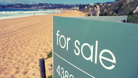 For sale sign on beach front property